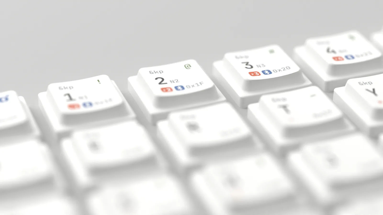 Close-up of the 1, 2 and 3 keys with keycode, F-key and Bluetooth legends